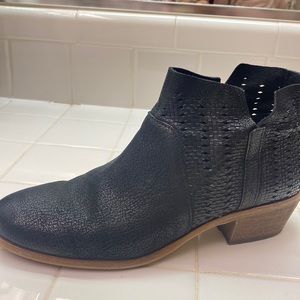 Black leather Vince Camuto booties.